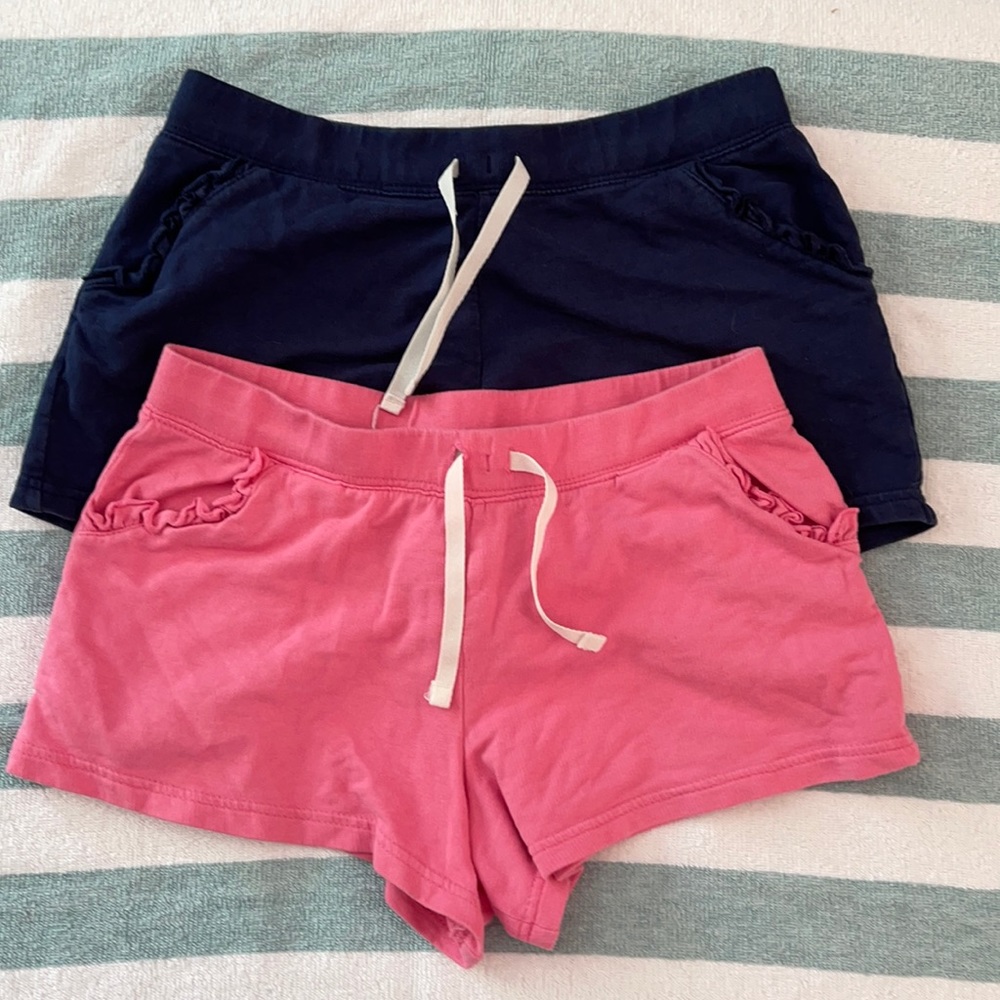 Two pair Carter’s cotton shorts with ruffle pocket